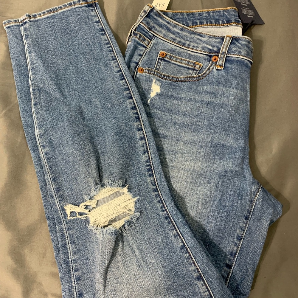 Blue jeans with distressing